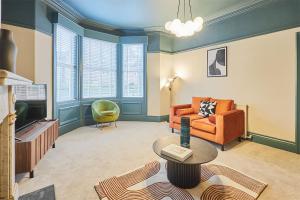 a living room with a couch and a table at Host & Stay - Kittiwake House in Whitley Bay