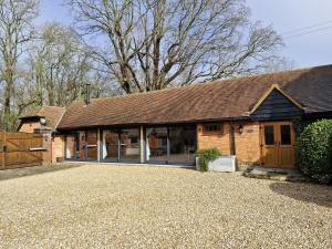 a house with a large driveway in front of it at Walnut Studio - Horsham in Horsham