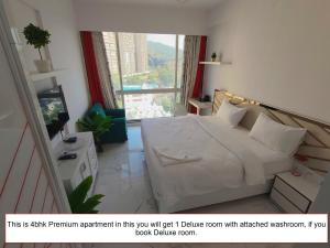 Voodi või voodid majutusasutuse Premium Apartment in Hiranandani Powai by Maxxvalue - Chitranjan toas
