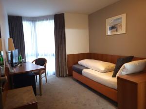 Ein Sitzbereich in der Unterkunft Concorde Hotel Ascot