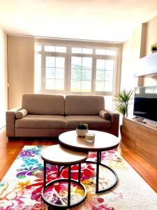 a living room with a couch and a table at Piso Vistas O Son in Cee