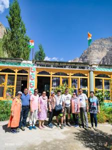 a group of people standing in front of a building at Tyakshi Summer Camp in Nubra