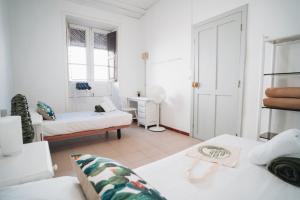 Postel nebo postele na pokoji v ubytování Hostal Colón
