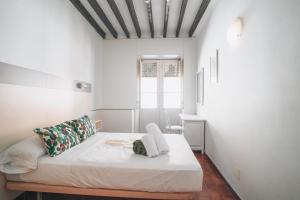 Postel nebo postele na pokoji v ubytování Hostal Colón