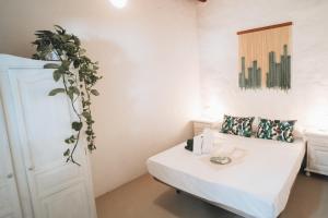 Postel nebo postele na pokoji v ubytování Hostal Colón