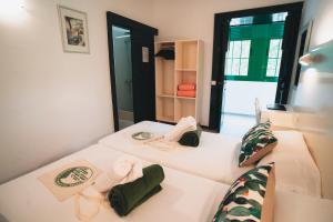 Postel nebo postele na pokoji v ubytování Hostal Colón