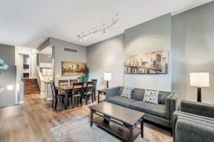 a living room with a couch and a table at Settle into Soulard 6 Bedrooms 4 full baths in Soulard