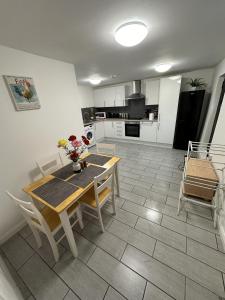 a kitchen and dining room with a table and chairs at Beautiful 1-Bed Apartment in Colchester in Colchester