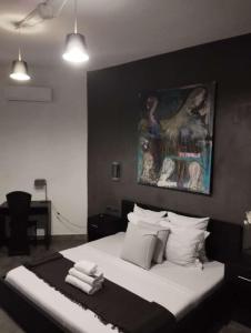 RESIDENCE MGA HOTEL客房内的一张或多张床位