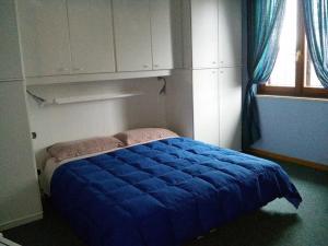 A bed or beds in a room at Le Magnolie B&B