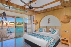 Postel nebo postele na pokoji v ubytování Panorama Bungalows Resort El Gouna + 37 fotografií