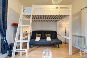 a room with a bunk bed and a couch at Le Marcel / Gare de Tours in Tours