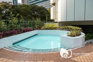 a swimming pool in the middle of a building at UBN by Plush in Kuala Lumpur
