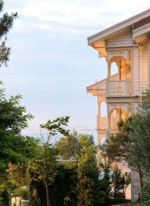 a large house with a balcony on the side of it at Princes' Palace Resort, Buyukada - Member of The Leading Hotels of the World in Adalar