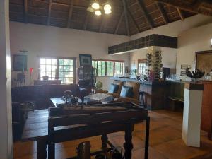 a living room with a couch and a table at Garrett Guest House in Pretoria