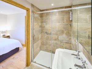 a bathroom with a shower and a sink and a tub at Host & Stay - Cobnut Barn in Ashford
