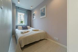 Posteľ alebo postele v izbe v ubytovaní Warsaw Concierge Silver Apartment