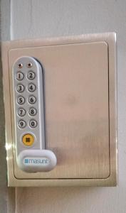 a metal door with a remote control on it at Terrace Home in Saint Vincent