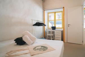 Postel nebo postele na pokoji v ubytování Hostal Colón
