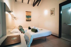 Postel nebo postele na pokoji v ubytování Hostal Colón