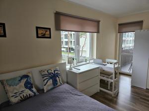 Posteľ alebo postele v izbe v ubytovaní Apartament Bałtyk