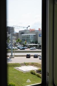 a view from a window of a parking lot at Hotel United PR in Prishtinë