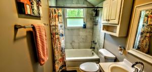 a bathroom with a tub and a shower and a sink at Cozy Nashville Duplex Unit B in Nashville +17 photos