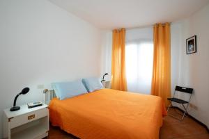Katil atau katil-katil dalam bilik di Casa di Titti by Wonderful Italy