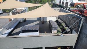 an overhead view of a balcony with a tent at Cozy room in three floor apartment in Mexico City