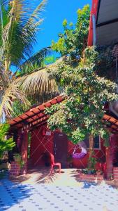 a house with a tree in front of it at Sakleshpur home stay in Sakleshpur