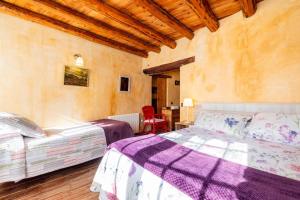 Postel nebo postele na pokoji v ubytování Can Miqueló - casa rural 16 hòstes