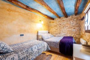 Postel nebo postele na pokoji v ubytování Can Miqueló - casa rural 16 hòstes