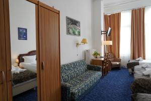 Ένα ή περισσότερα κρεβάτια σε δωμάτιο στο City Pension Berlin