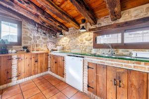 Kuchyň nebo kuchyňský kout v ubytování Can Miqueló - casa rural 16 hòstes