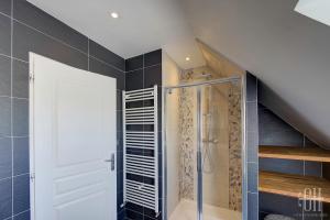 a bathroom with a shower and a glass door at Le Bel Air / Maison de famille in Saint-Avertin +27 photos