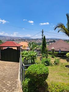 a view of a city from a park with a bench at Green Valley in Kigali