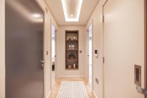 a hallway with a door and a tile floor at Entire 1 Bed - Number 23 - The Cosy Collection Ltd in York