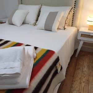 A bed or beds in a room at Regresso as Origens