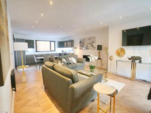 a living room with a couch and a table at Pass the Keys Super King Penthouse Minutes from Arndale Centre in Manchester
