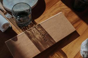 a glass of water sitting on top of a table at nhow Amsterdam Rai in Amsterdam