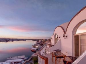 a view of the water from the balcony of a house at NUB INN in Aswan