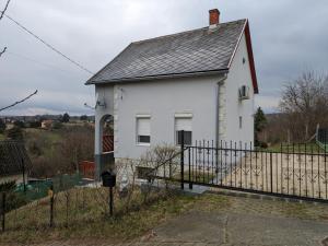 a white house with a fence in front of it at Marvel-Nyaraló in Igal