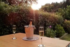 two glasses of wine sitting on a table with a blender at Quiet Devon Luxury Escape 3-Bed in Honiton +35 photos