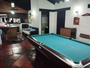 a living room with a pool table in it at Finca el hato in Palmira