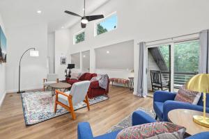 a living room with a couch and chairs at Cardinal Cove-Nature Escape-3 MI to Dam in Eureka Springs