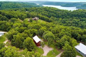 an aerial view of a barn in the middle of a forest at Cardinal Cove-Nature Escape-3 MI to Dam in Eureka Springs