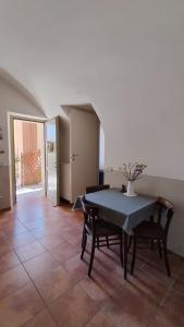 a dining room with a table and two chairs at La Locanda di Campagna a Guardabosone 