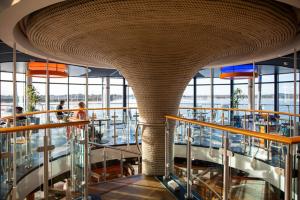 a large building with a circular ceiling and a cafeteria at RNLI College in Poole