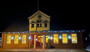 a building with its doors lit up at night at Alte Schmiede Hotel & Restaurant in Jork