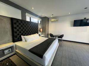 Postel nebo postele na pokoji v ubytování Hotel 47 Medellin Center